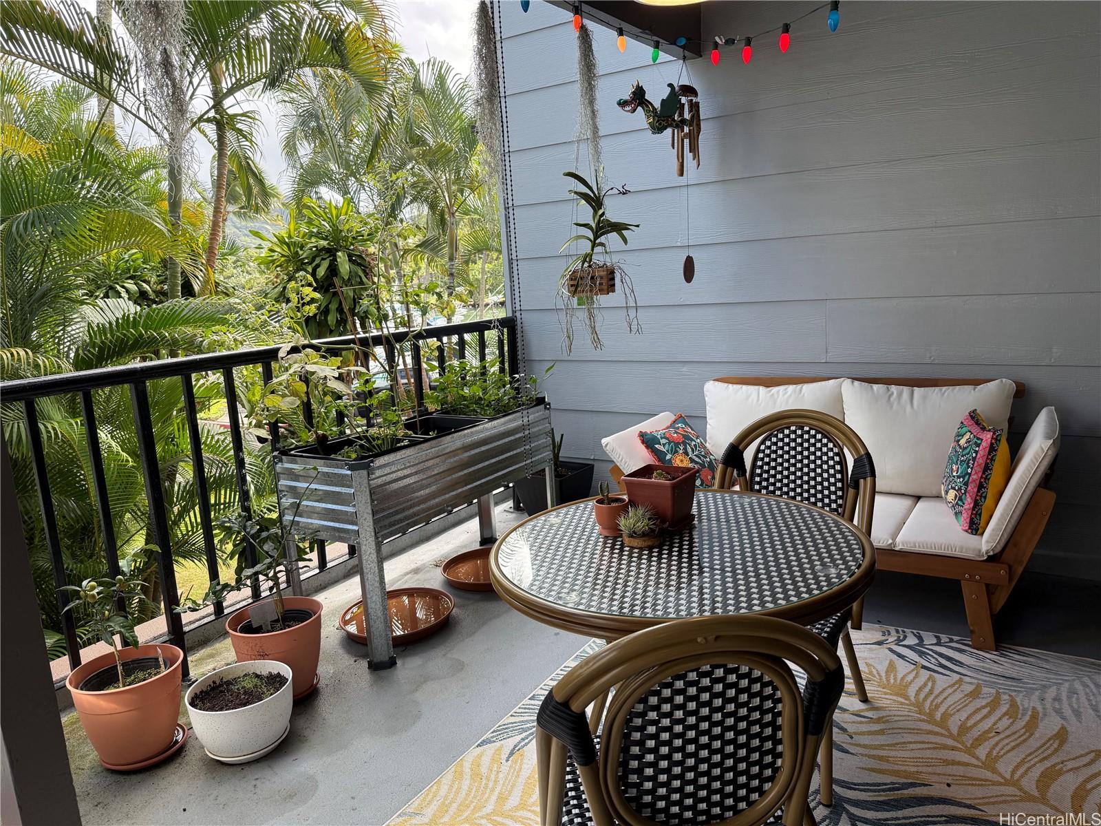 The front lanai is nicely screened by the landscaping for privacy, but also has a peek at the marina.