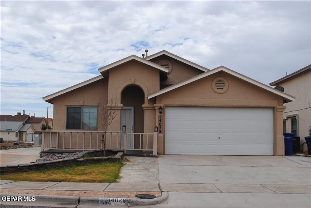 a front view of house with yard space and balcony