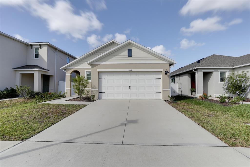 a front view of a house with yard