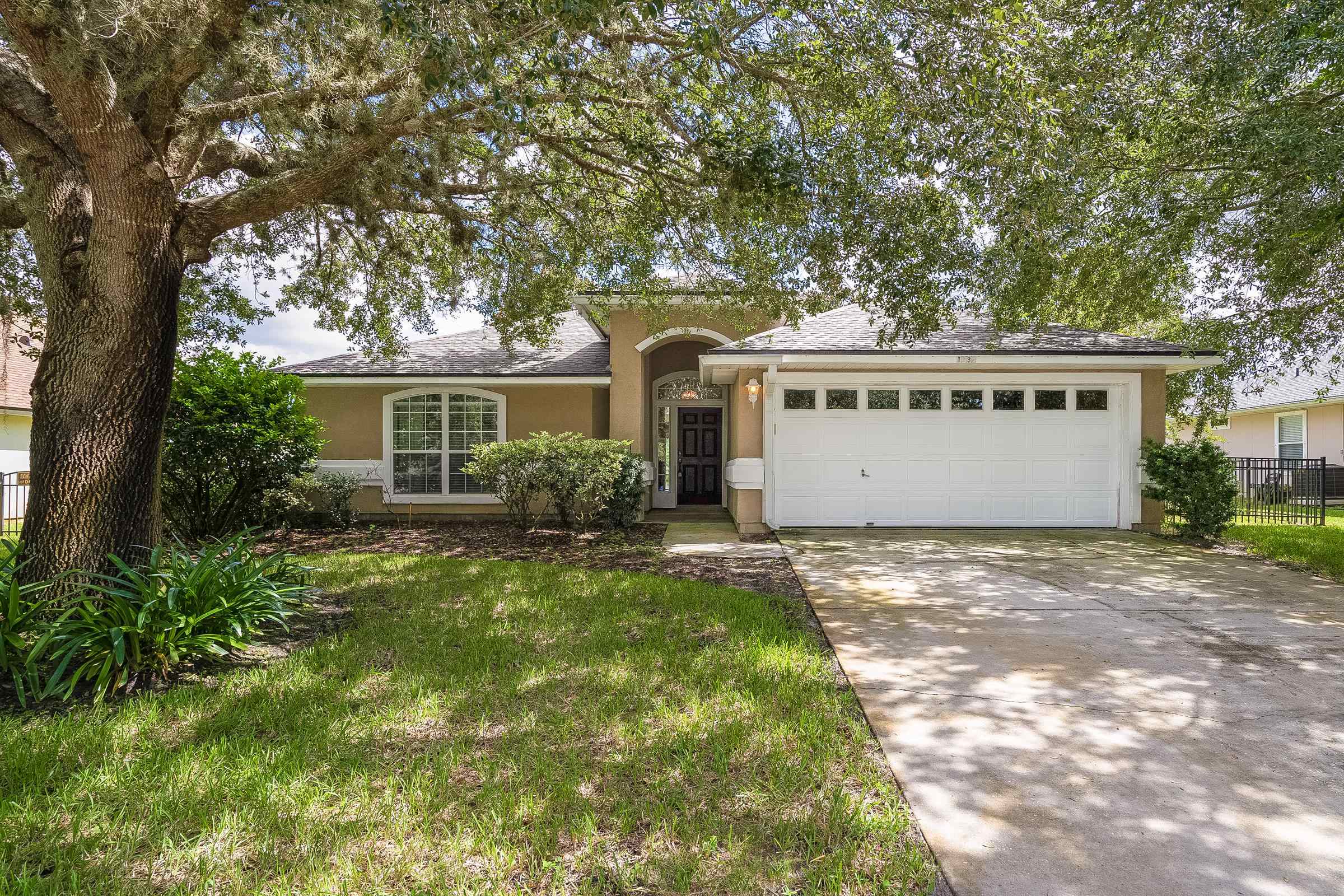 a front view of a house with a yard