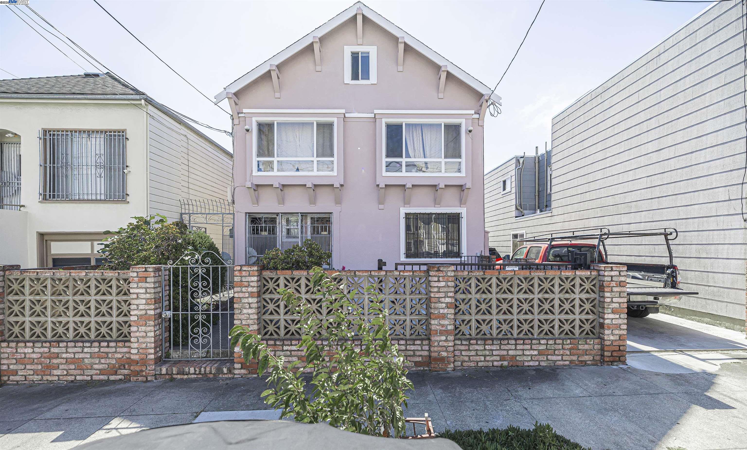 a front view of a house with a fence