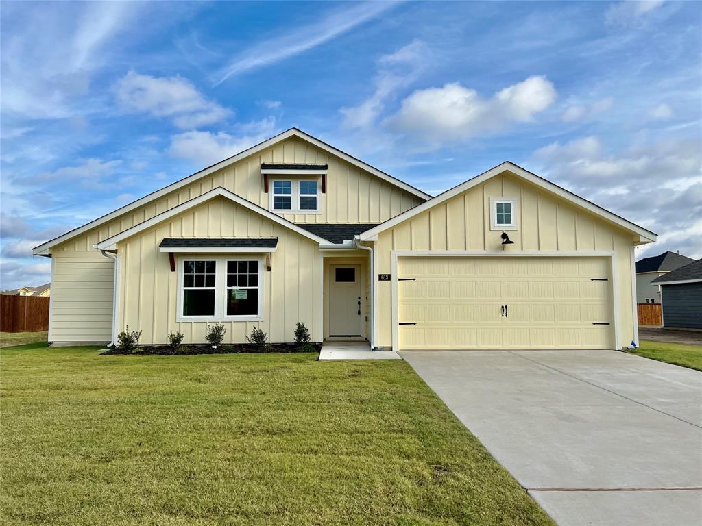 a front view of a house with yard