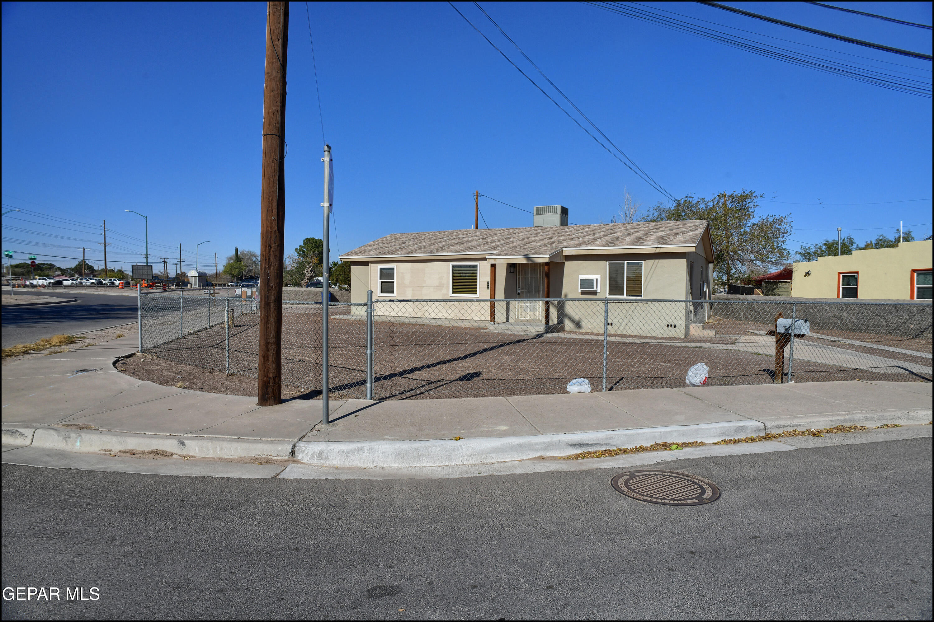 a view of a house next to a road