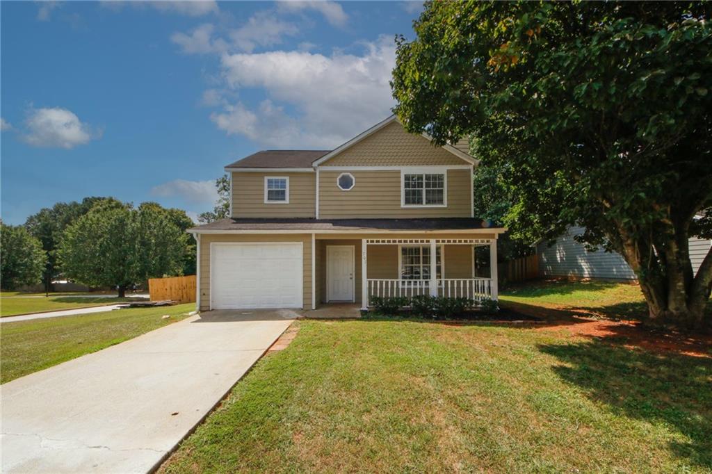 a front view of a house with a yard