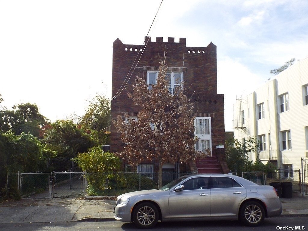 a front view of a house with parking space