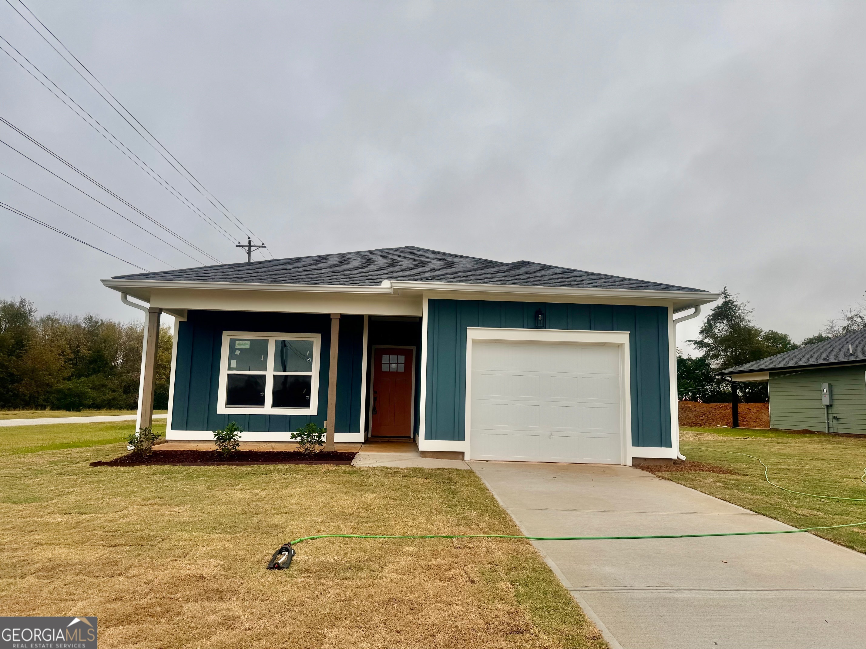 front view of a house with a swimming pool