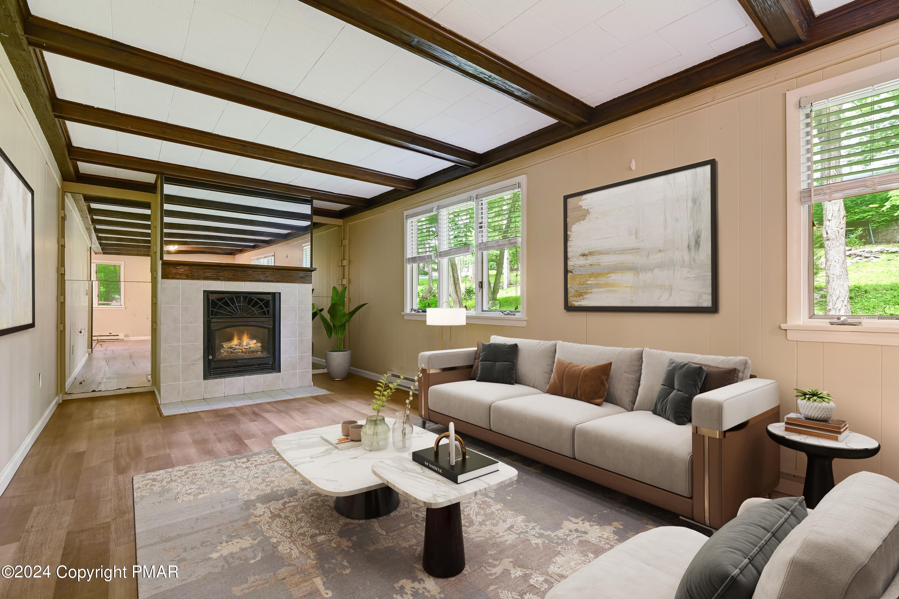 a living room with furniture and a fireplace