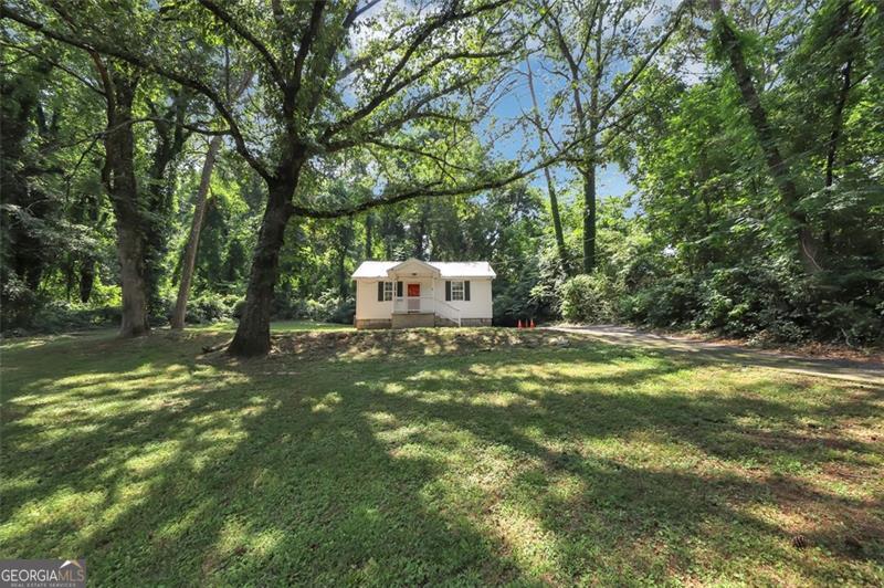 a view of a trees with a yard