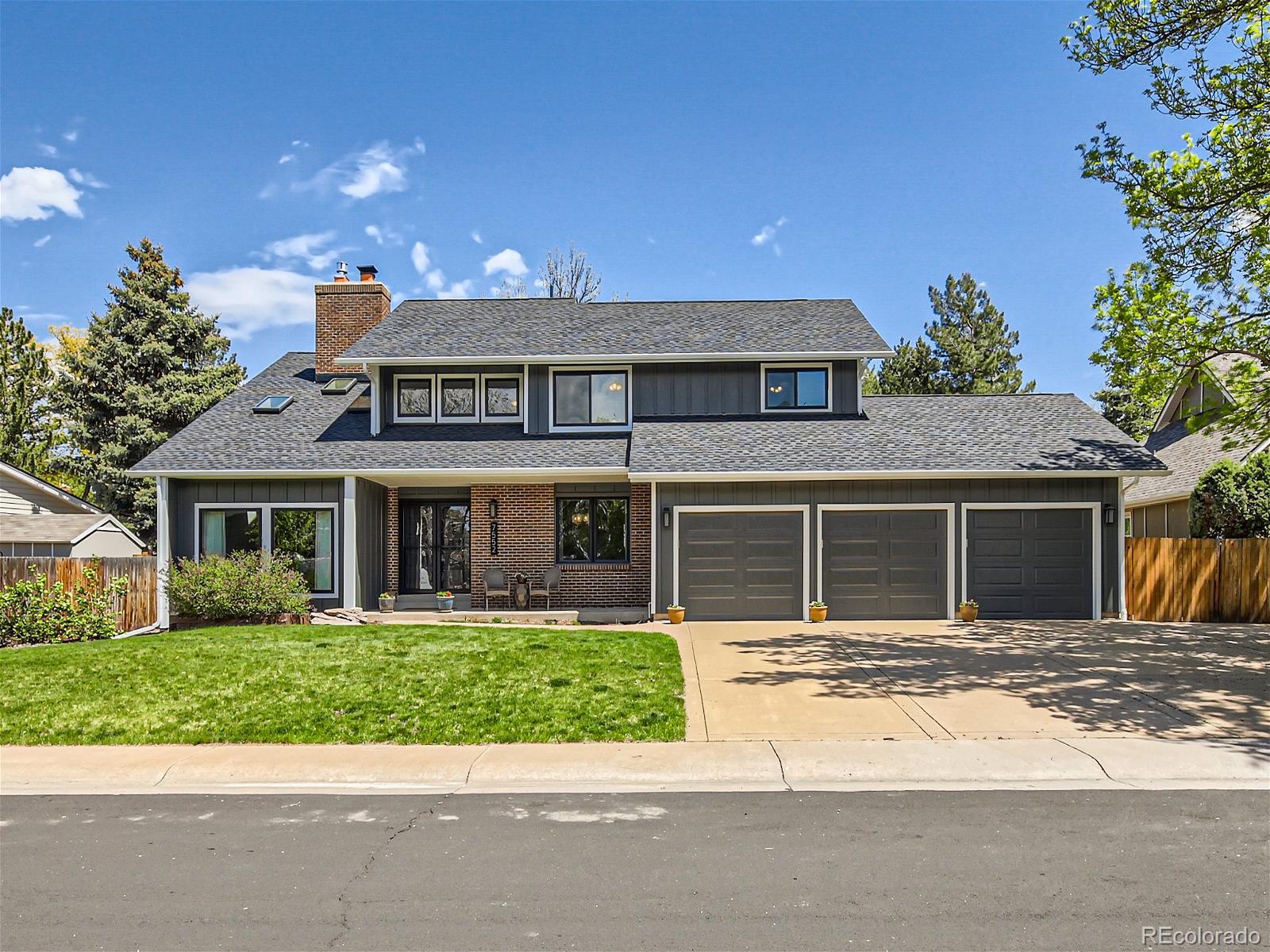 front view of a house with a yard