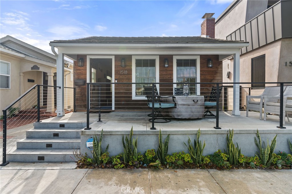 a front view of house with a garden