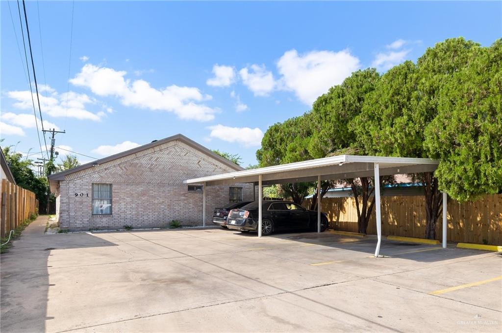 View of parking featuring a carport