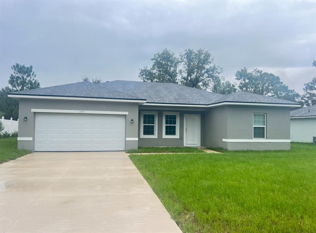 front view of a house with a yard