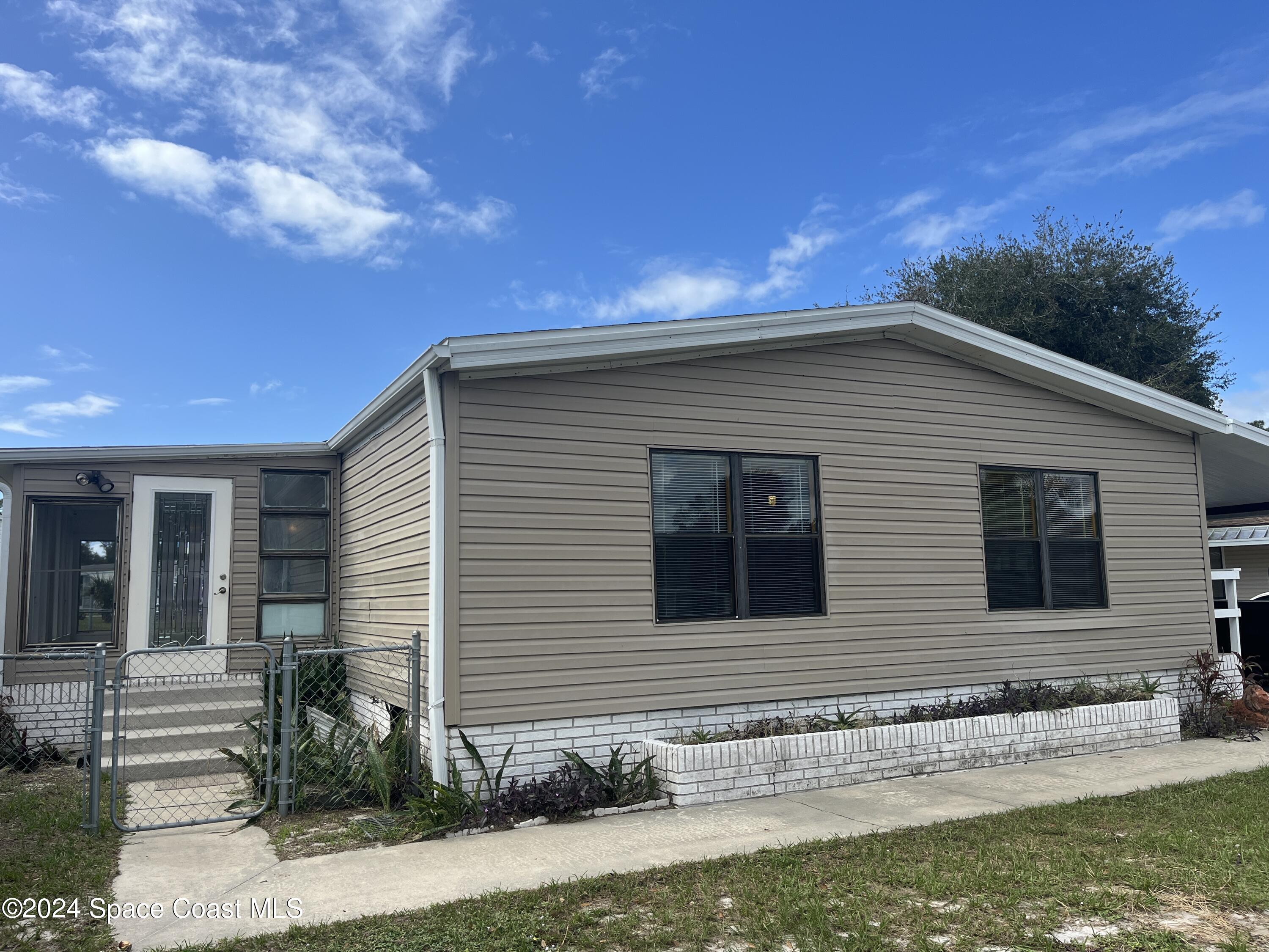 a front view of house with yard