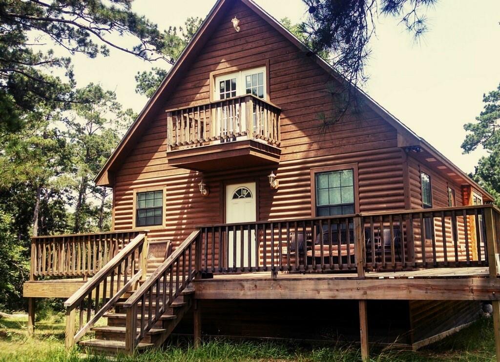 a front view of a house with a deck