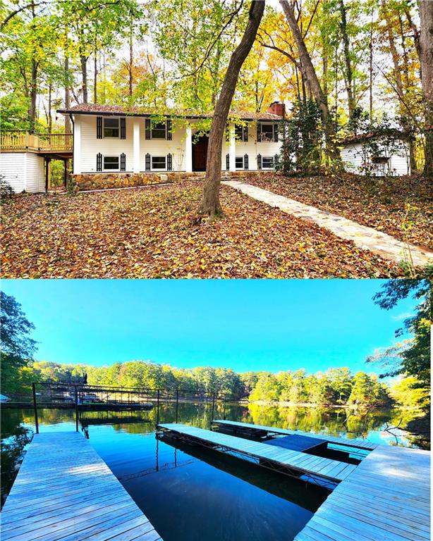 a front view of a house with a yard and lake view