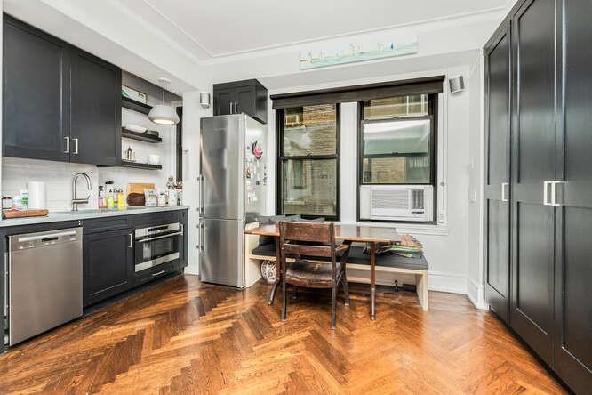 a kitchen with stainless steel appliances granite countertop a refrigerator and a stove top oven