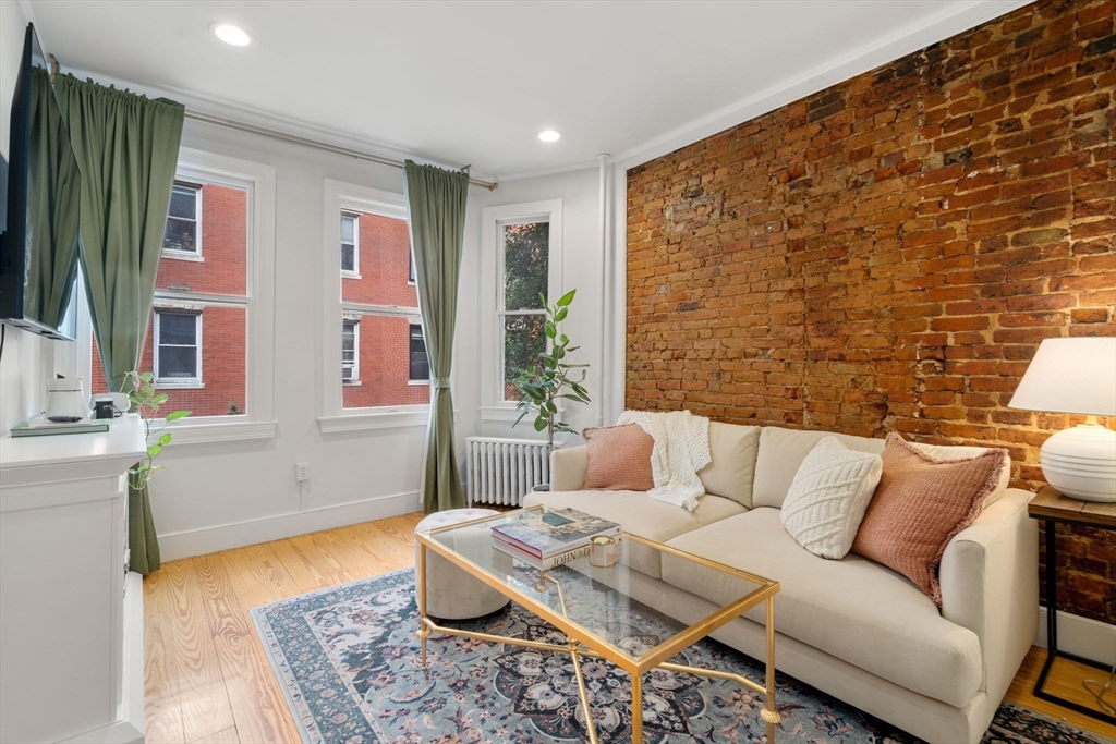 a living room with furniture and a rug