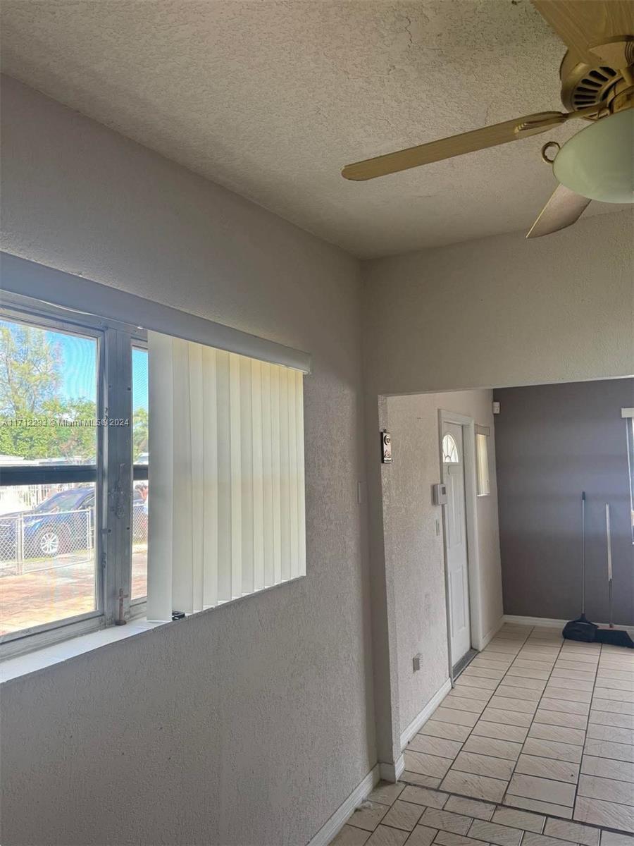 a view of an empty room and window