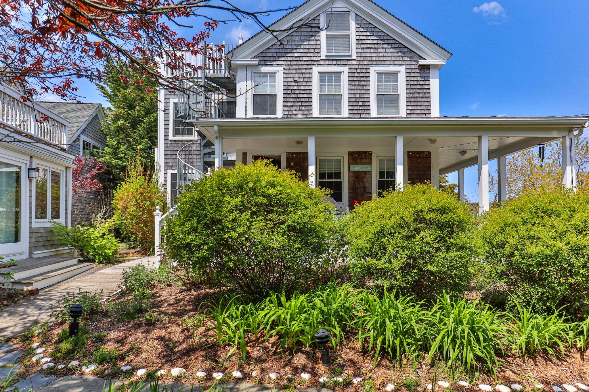 front view of a house with a garden