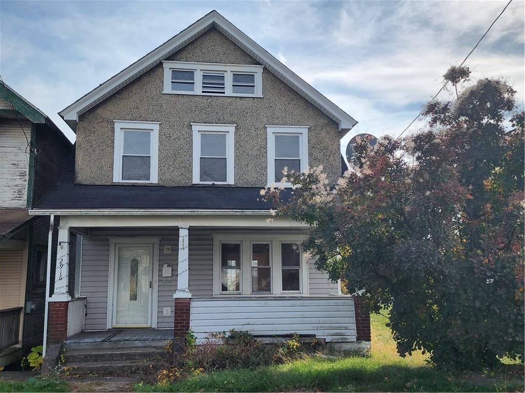 a front view of a house with a porch