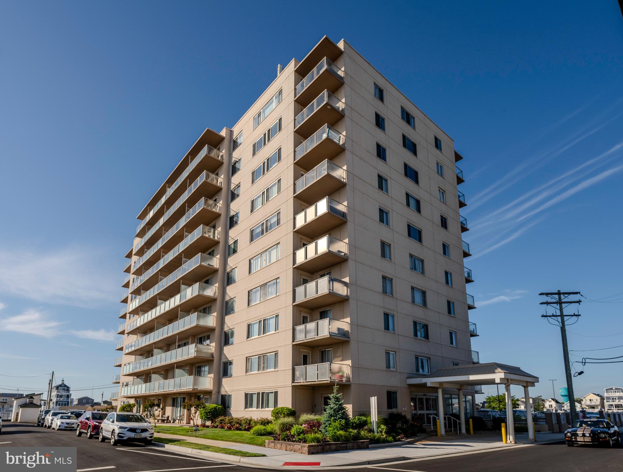 a view of a tall building next to a street