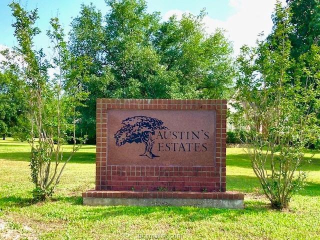 a view of a park that has a sign board