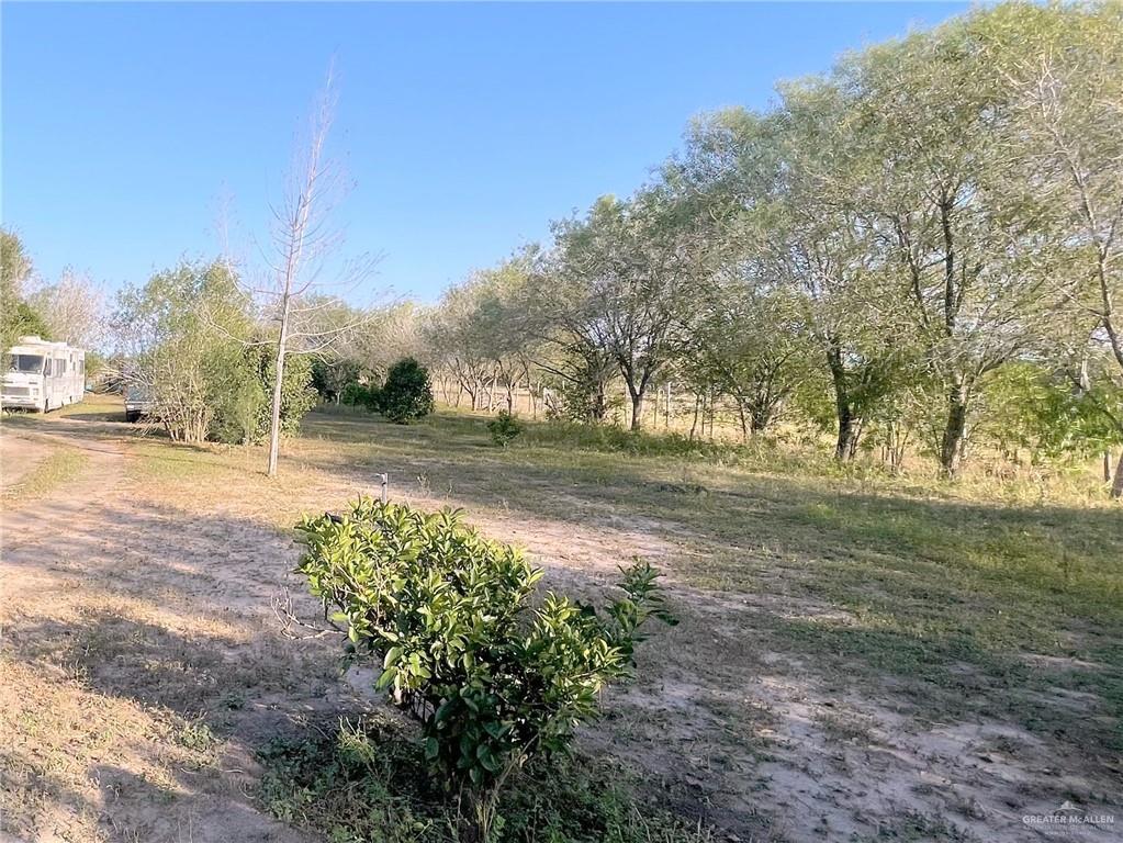 View of yard with a rural view