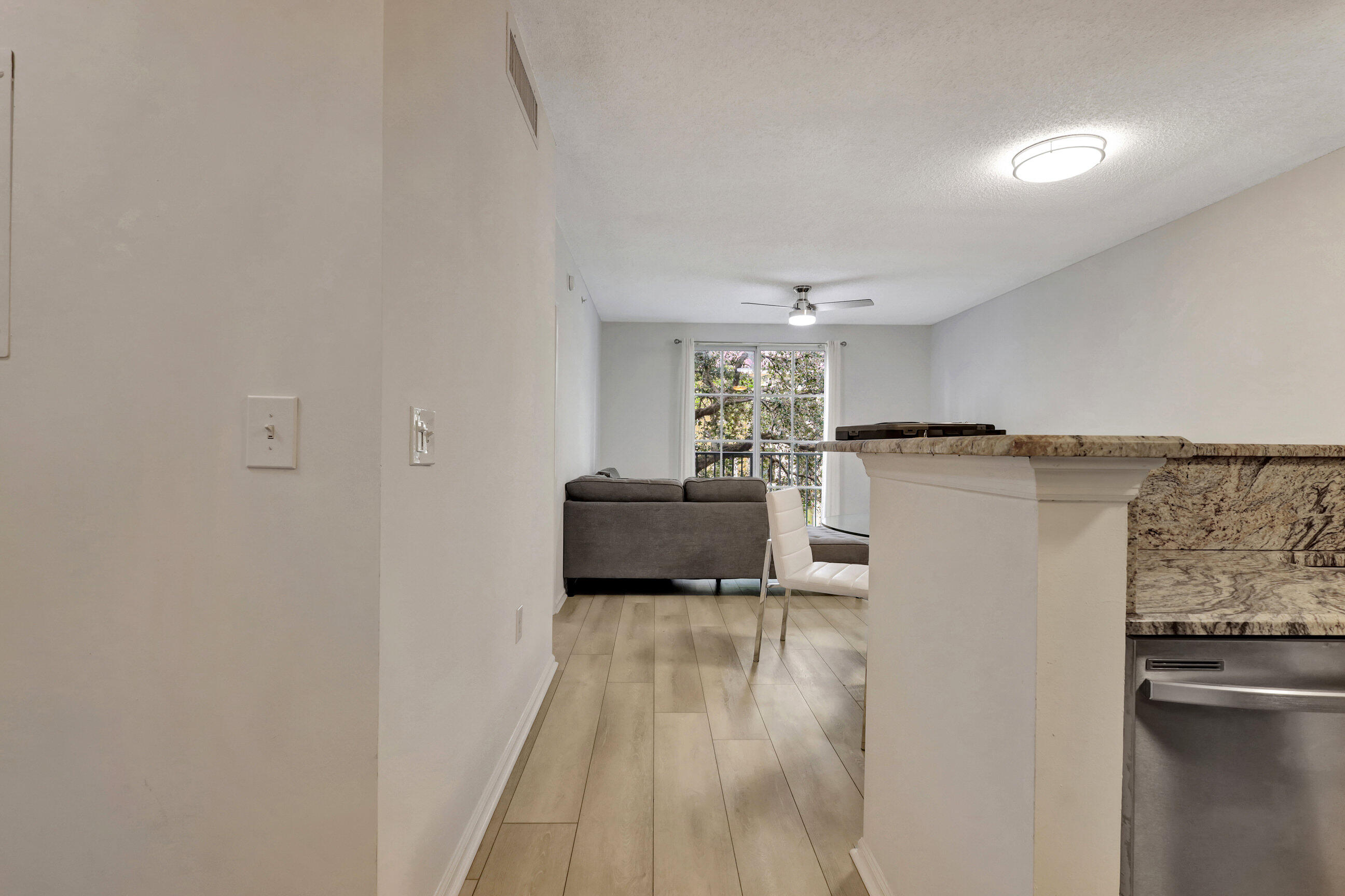 a kitchen with a refrigerator and a sink