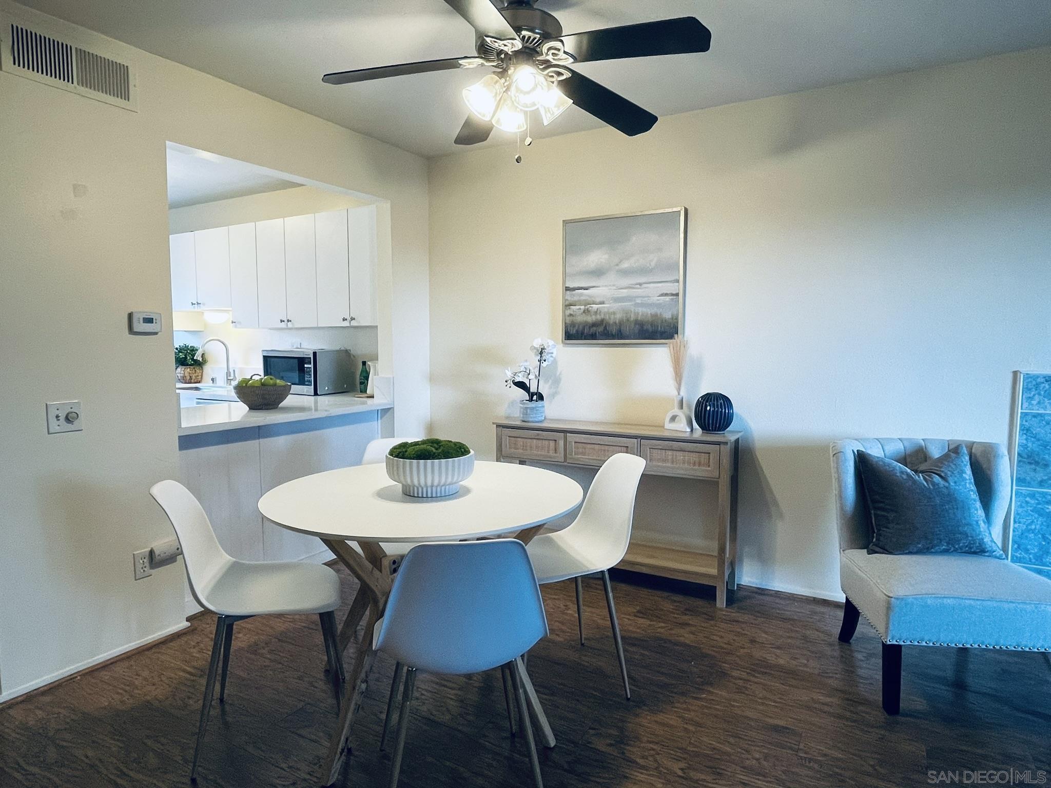 a view of a dining room with furniture and wooden floor