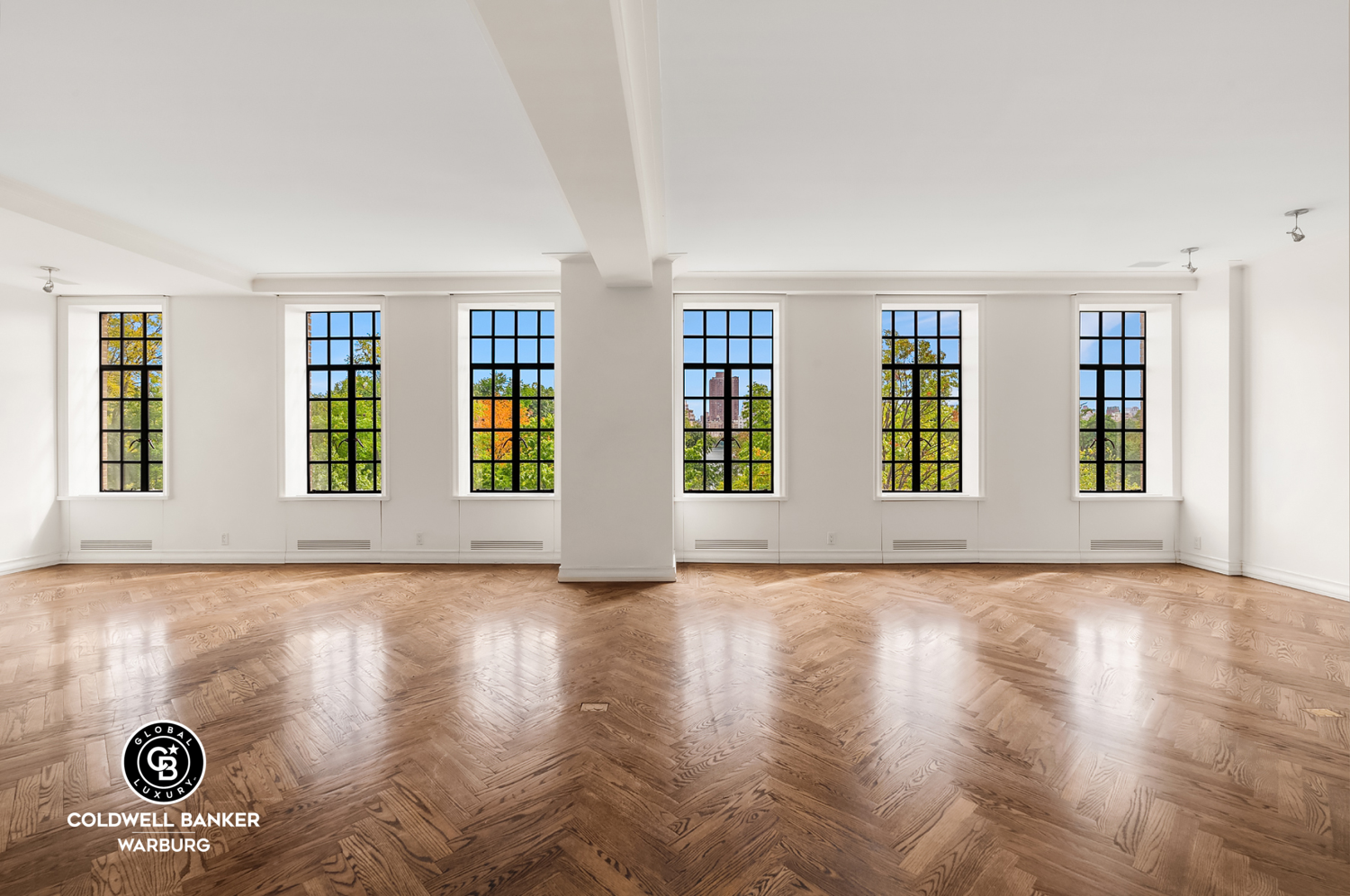 a view of an empty room with windows