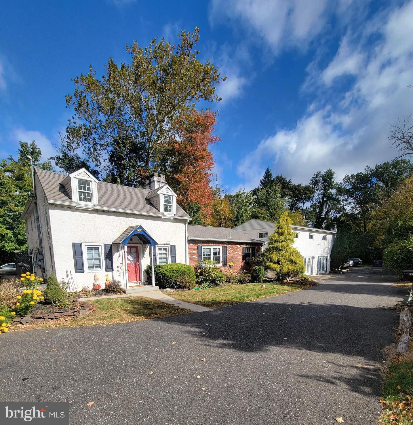 a front view of a house with a yard and a garage