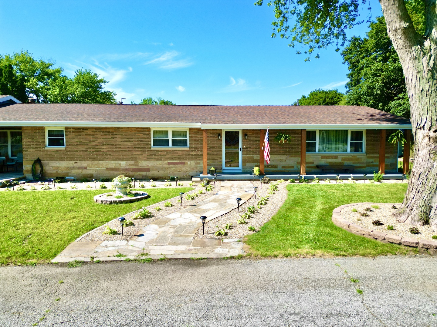 front view of a house with a yard