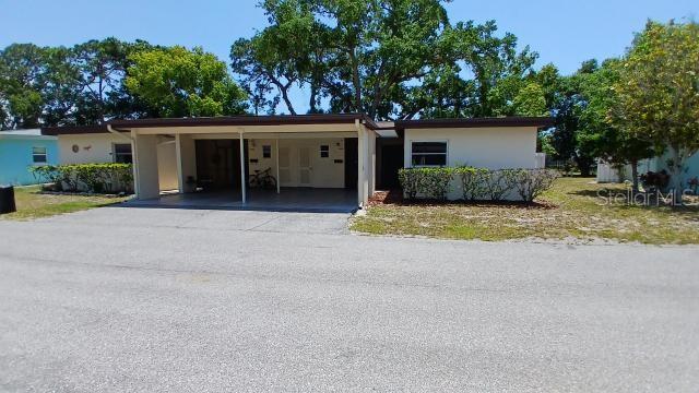 front view of a house with a patio