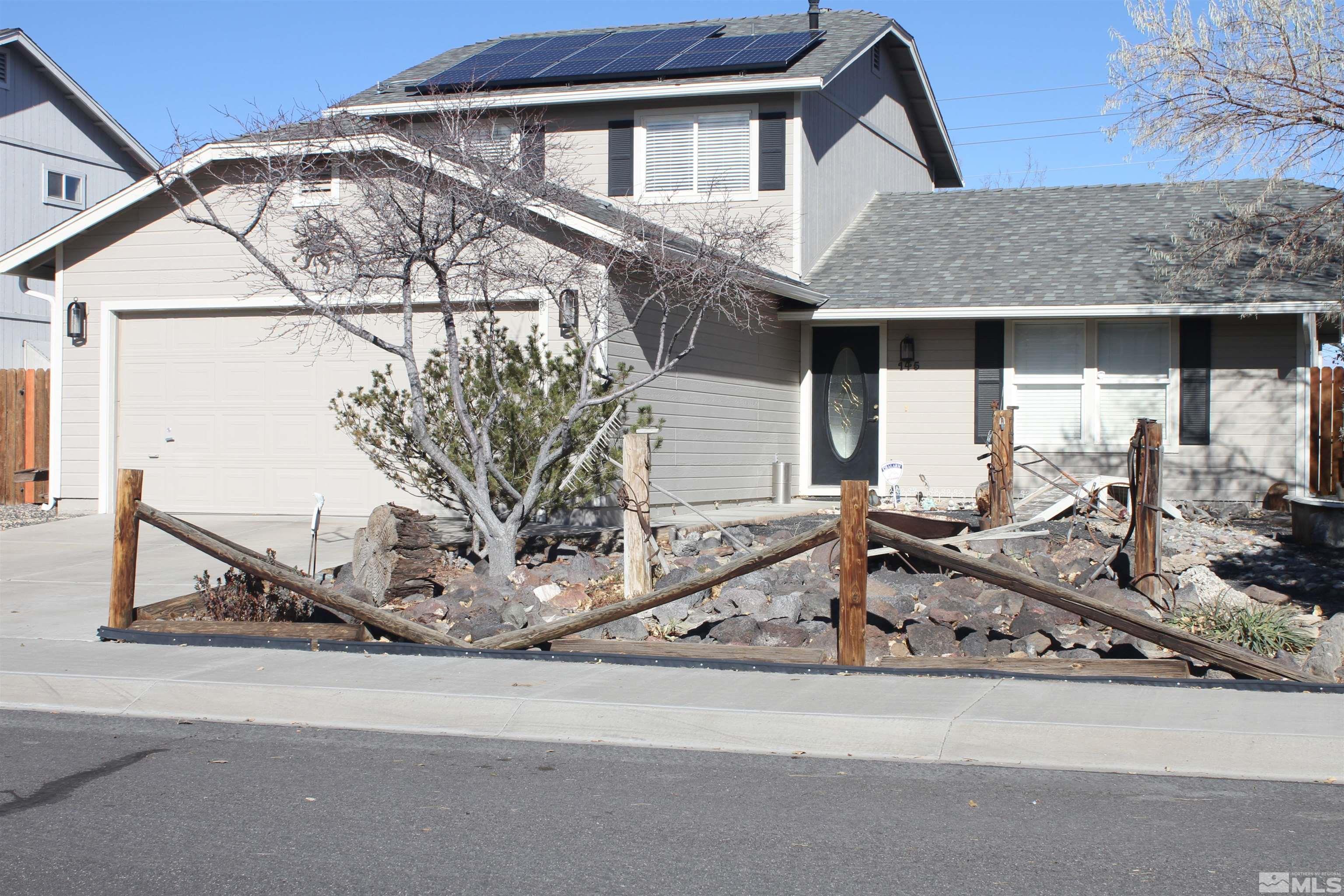 a front view of a house with parking area