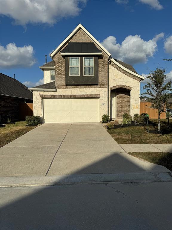 a front view of a house with yard