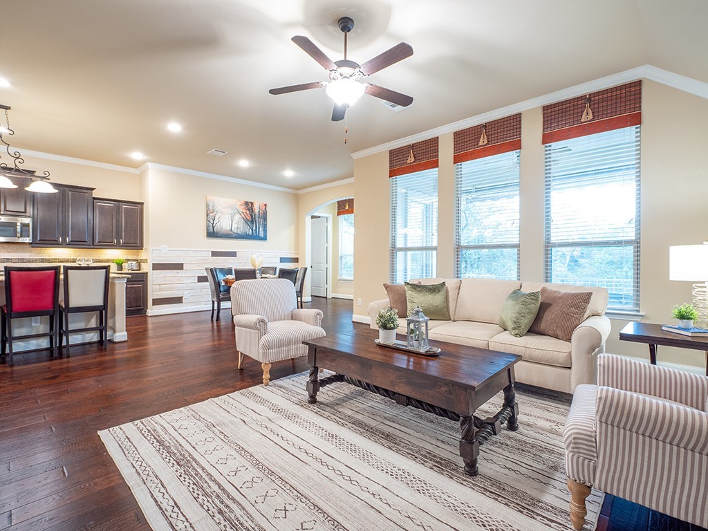 a living room with furniture and a table