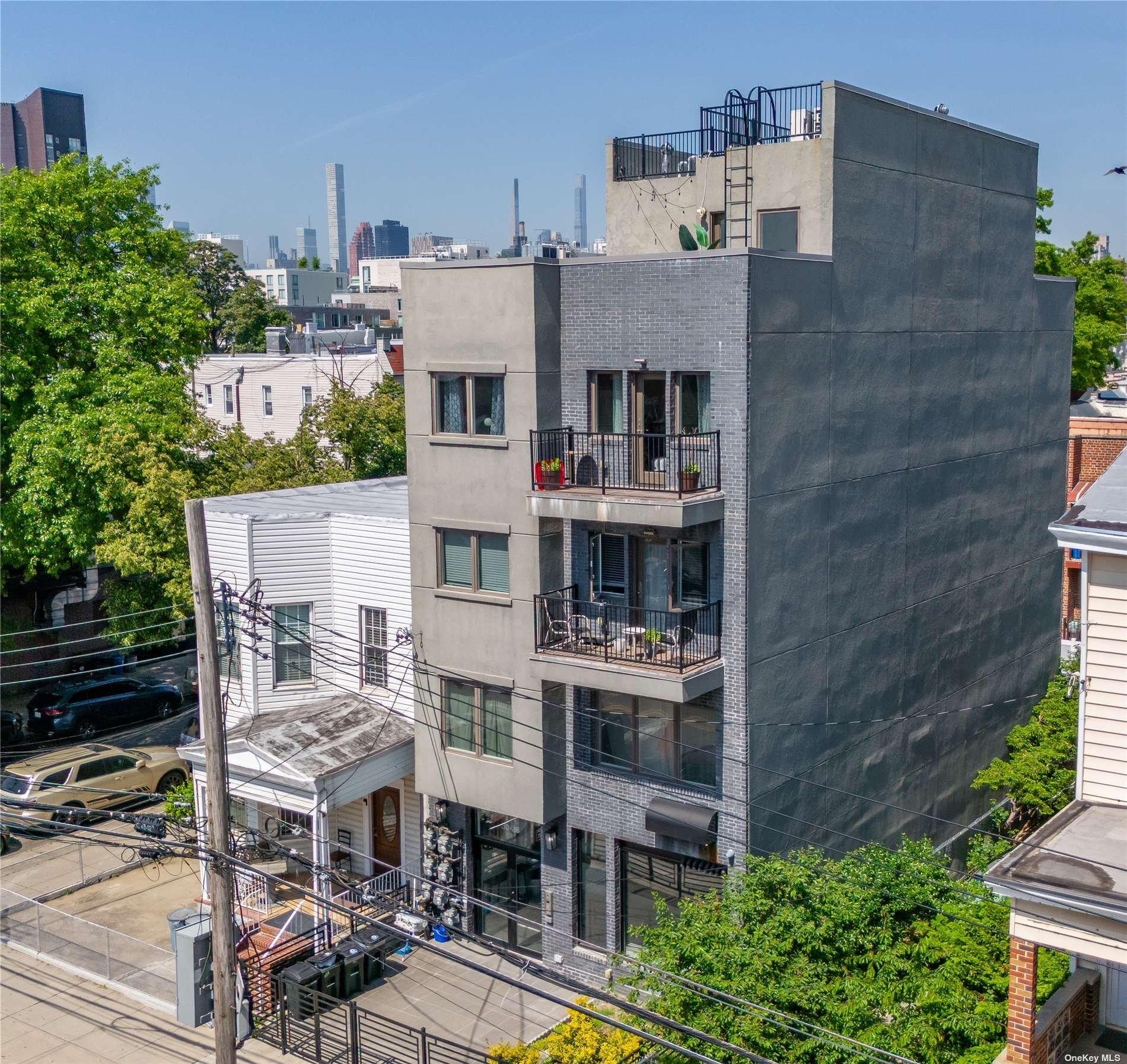 a aerial view of multi story residential apartment building with yard