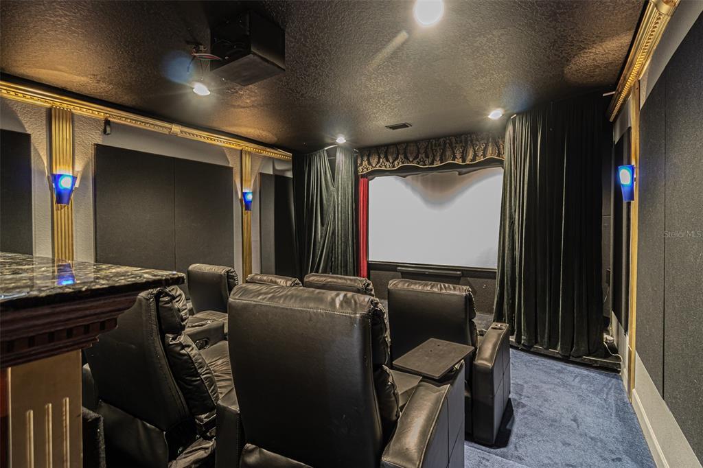 a room with furniture and musical instruments