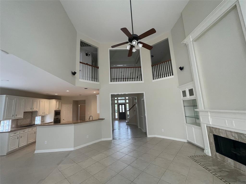 a view of living room kitchen with furniture and fireplace