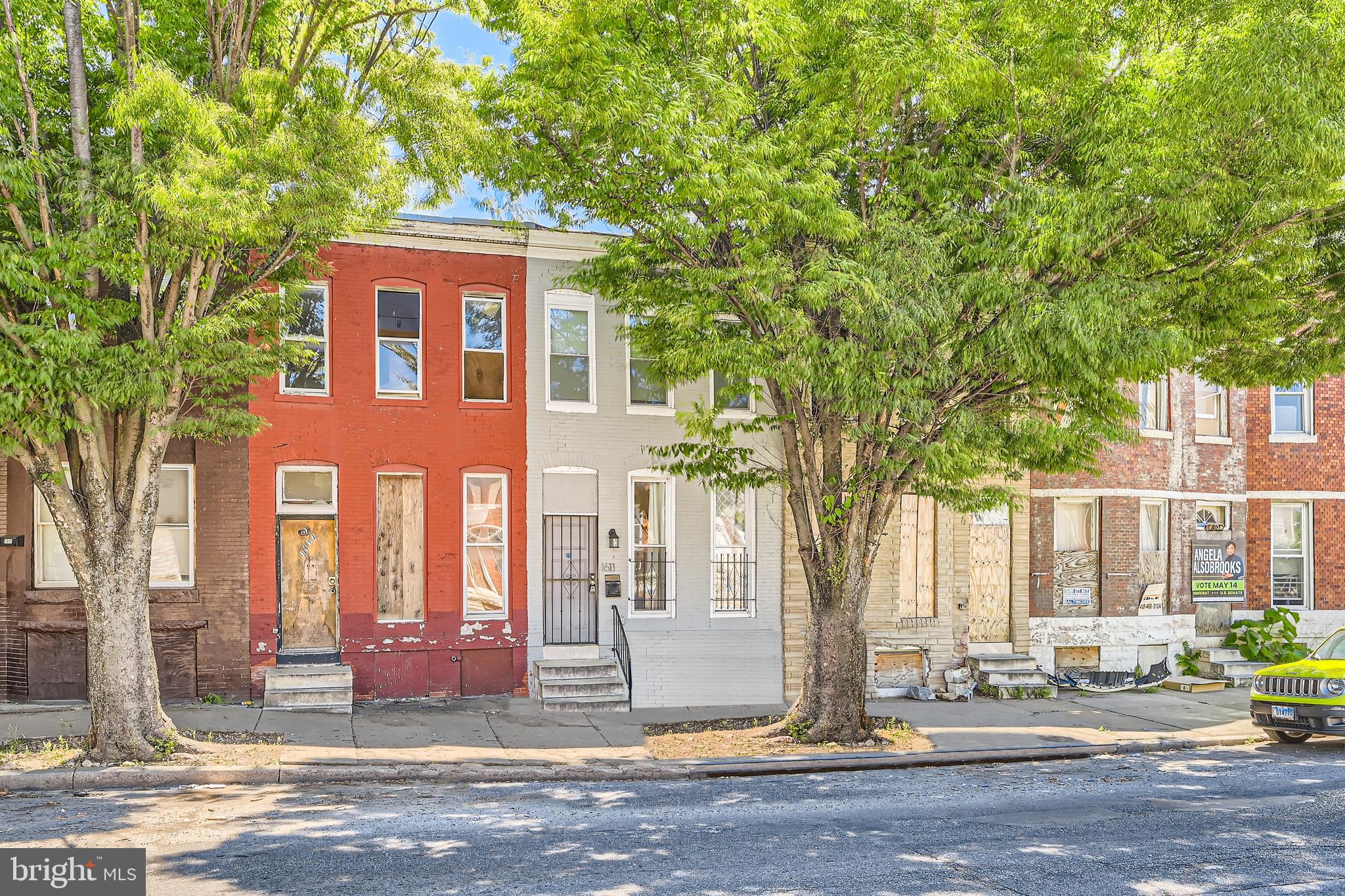 a front view of a house with street view