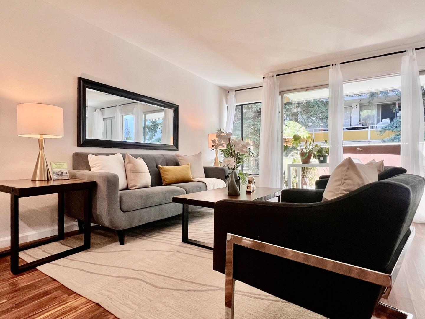 a living room with furniture and a large window