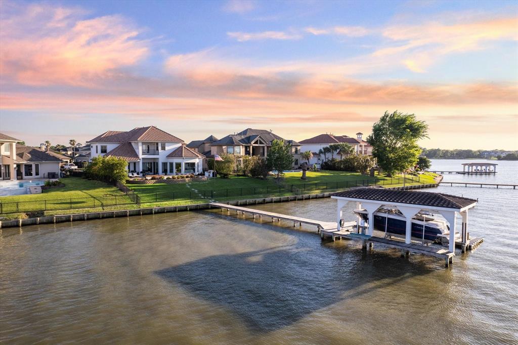 swimming pool view with a lake view