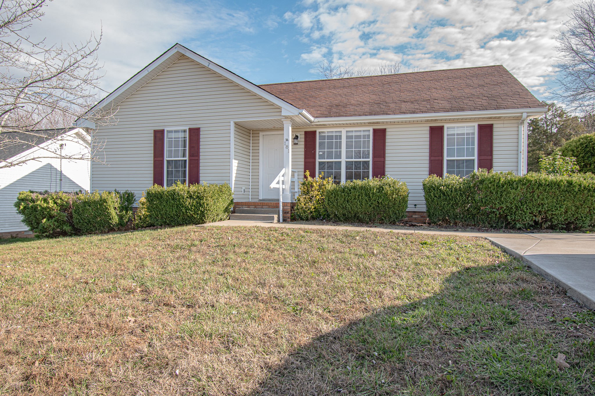 a front view of a house with a yard