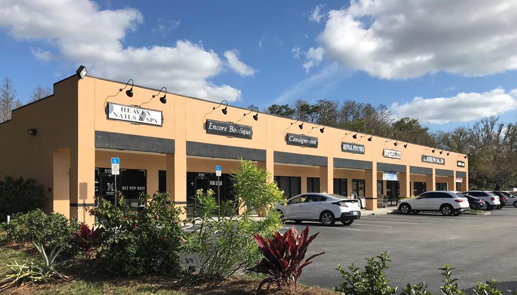 a view of a building with car parked