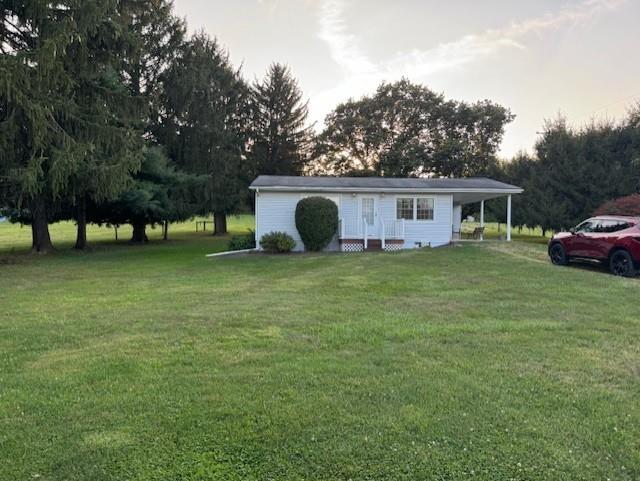 a view of a house with a yard