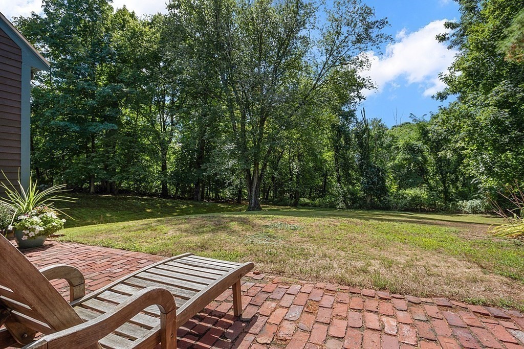 a view of a backyard with sitting area