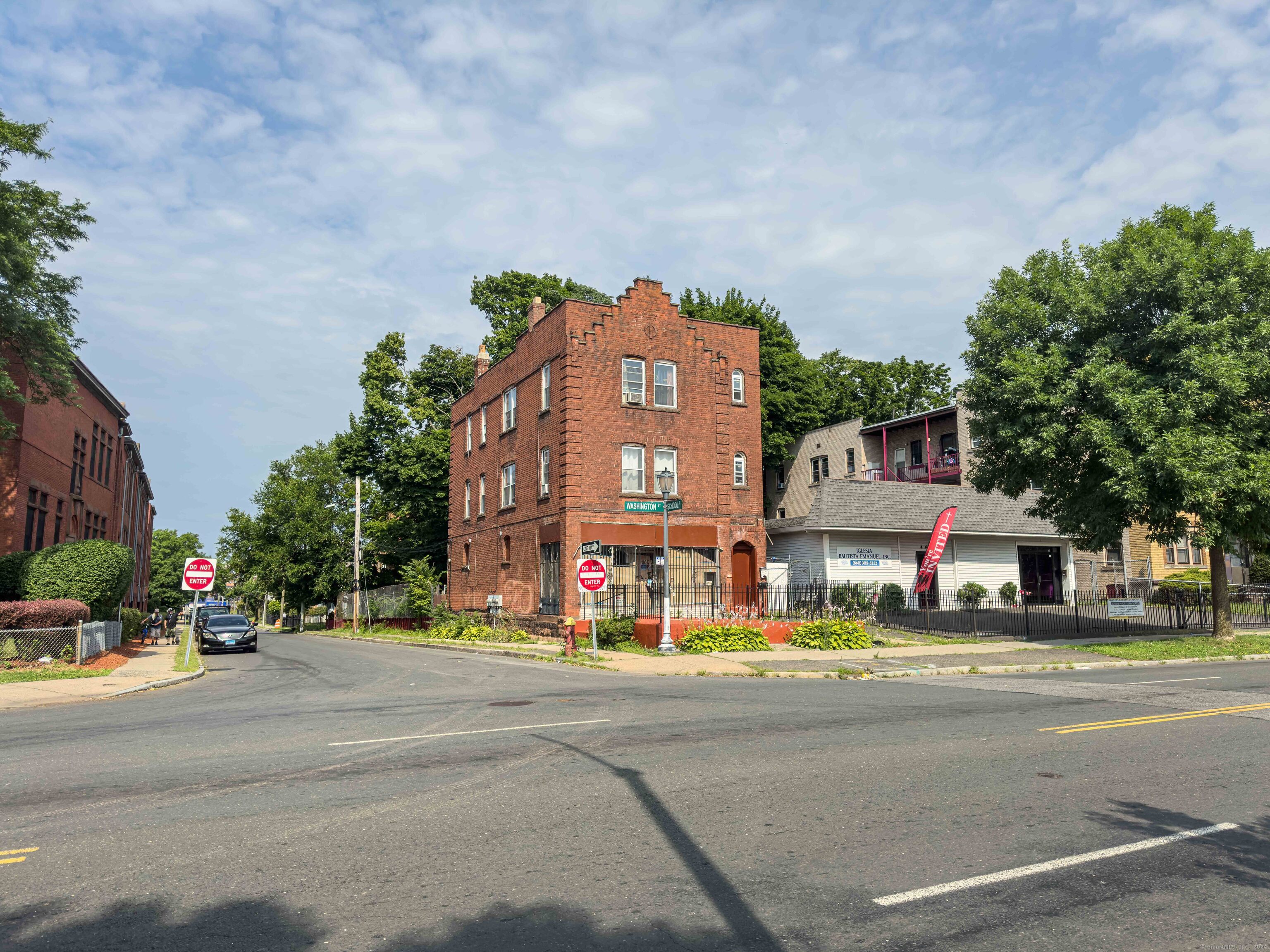 a view of a building with a street