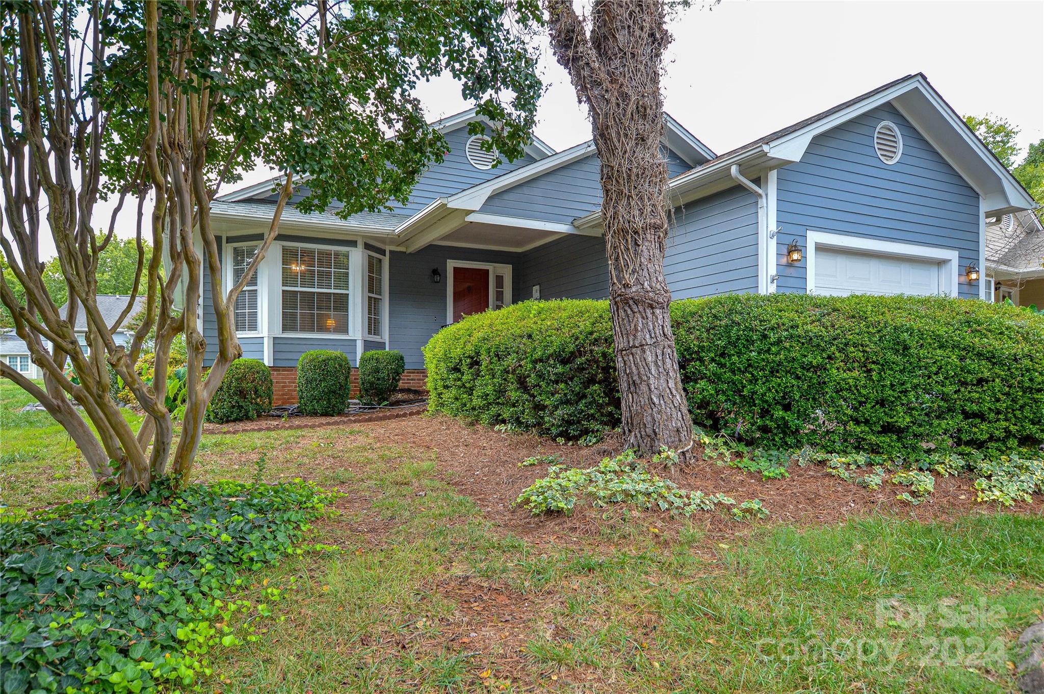 front view of a house with a yard