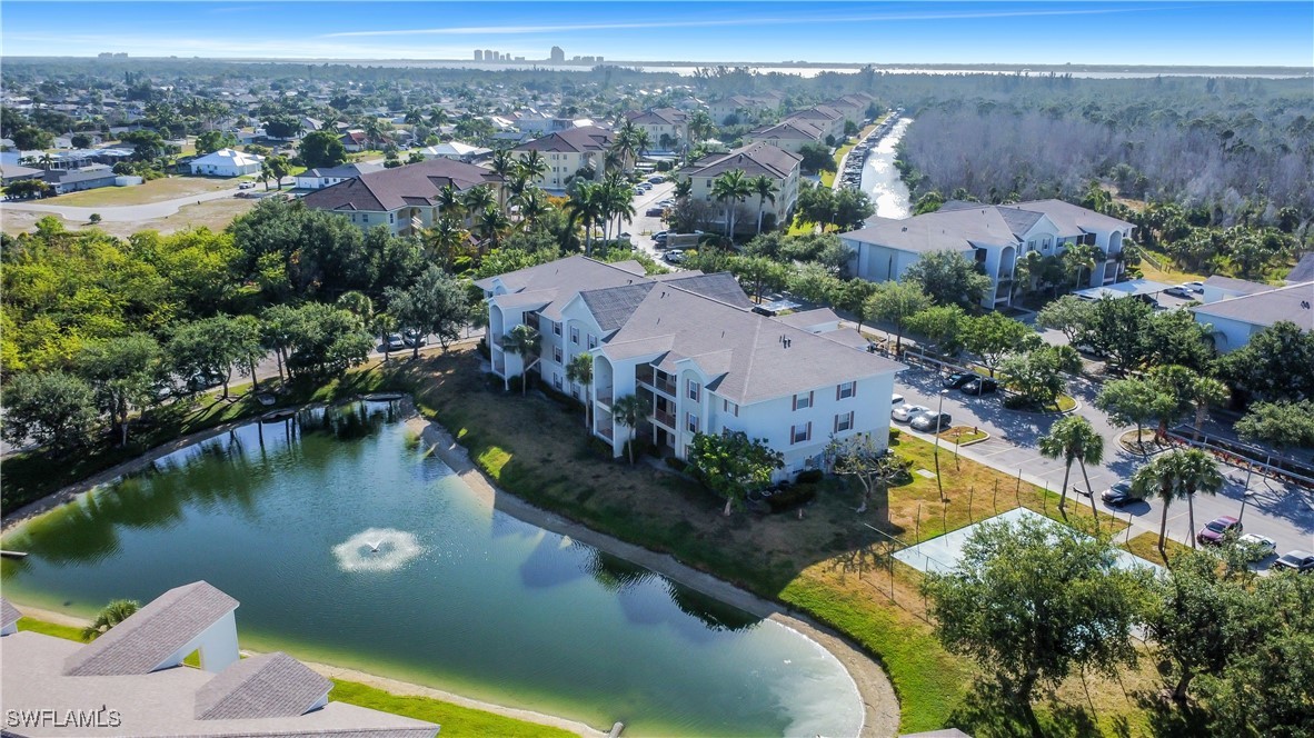 an aerial view of a house with a lake view