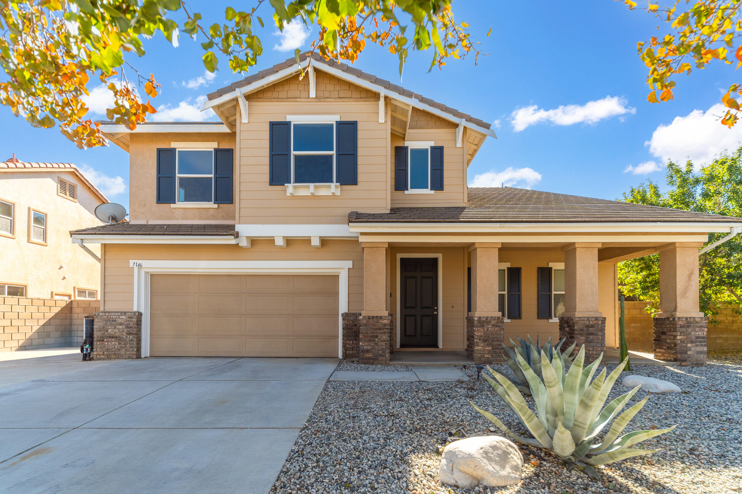 a front view of a house with a garage